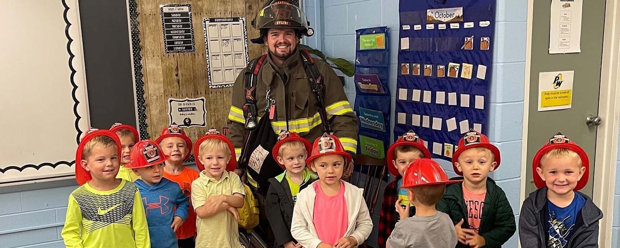 Elementary Students with Firefighter