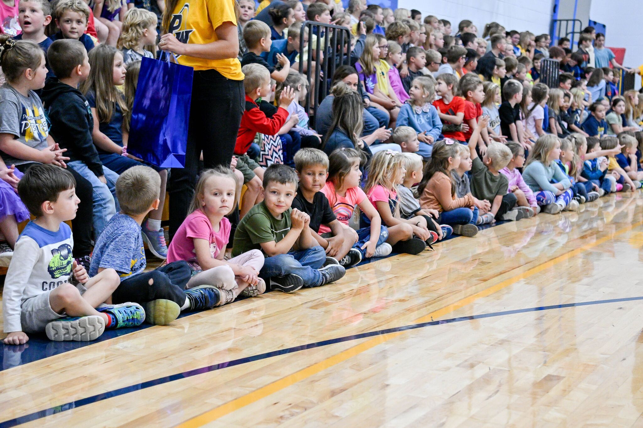 Elementary students sitting at assembly