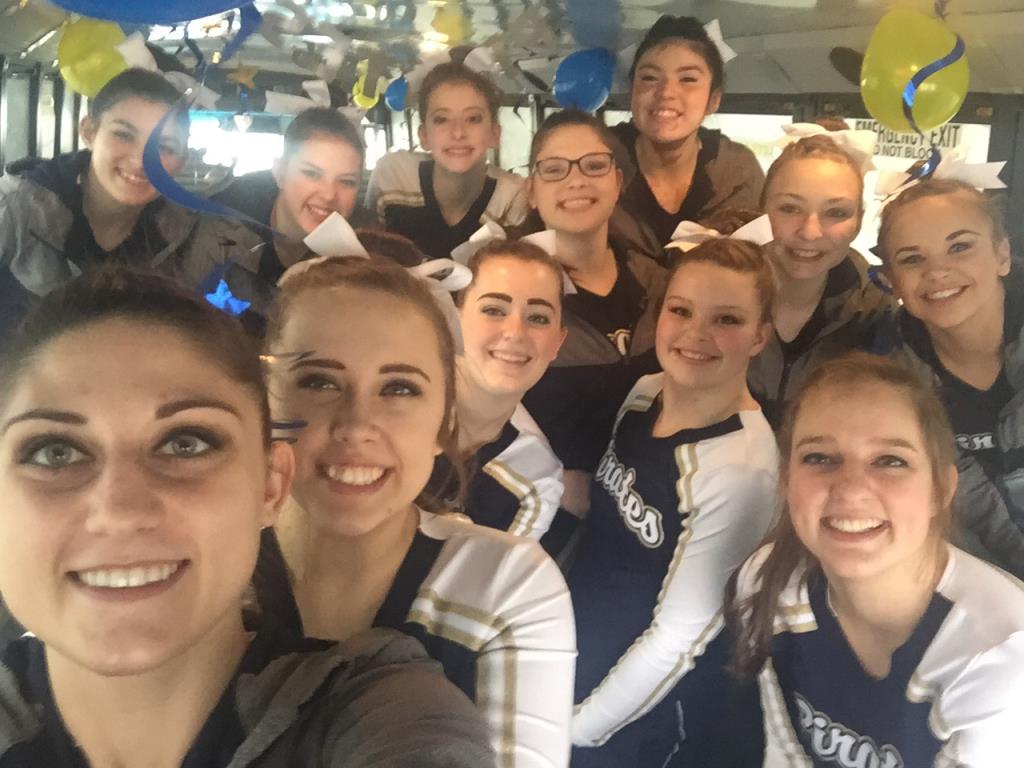 The PW varsity cheer team are all smiles on the way to regionals.