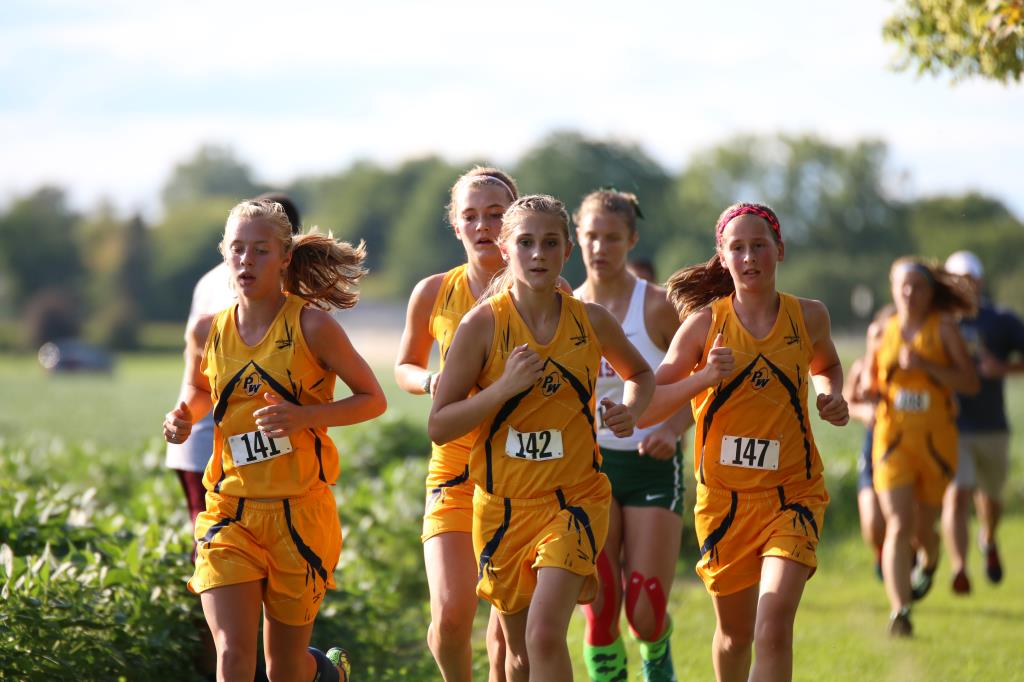 Members of the girls' PW varsity cross country race during the 2016 season.
