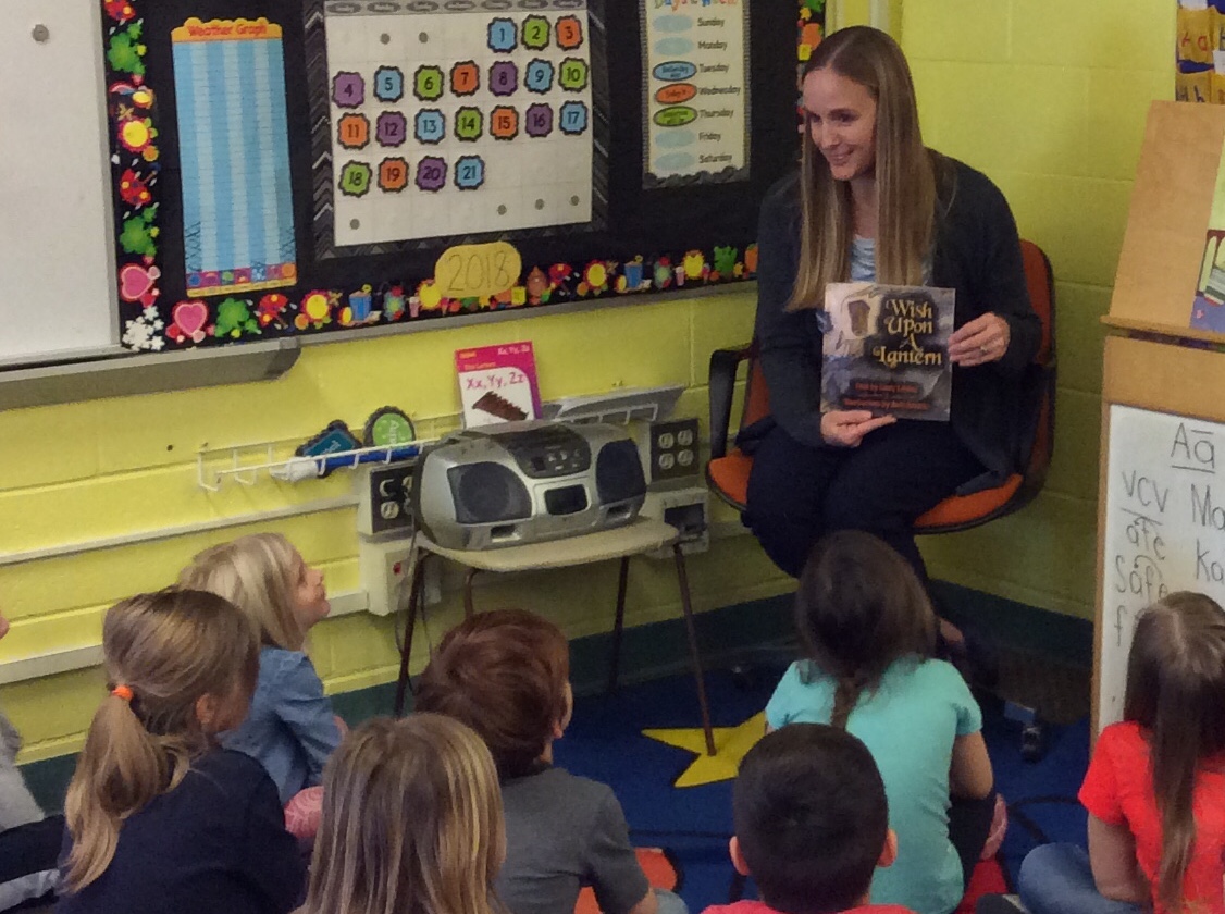 Julie Farmer reading to students