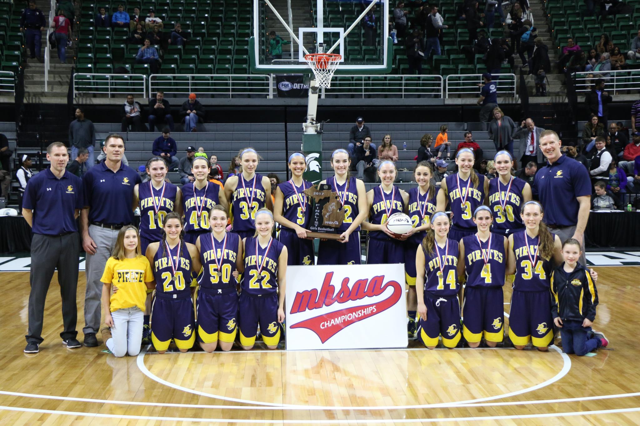 The 2017 MHSAA Girls' Basketball Class C State Runners-Ups pose for a picture at the Breslin Center on the campus of MSU March 18, 2107.