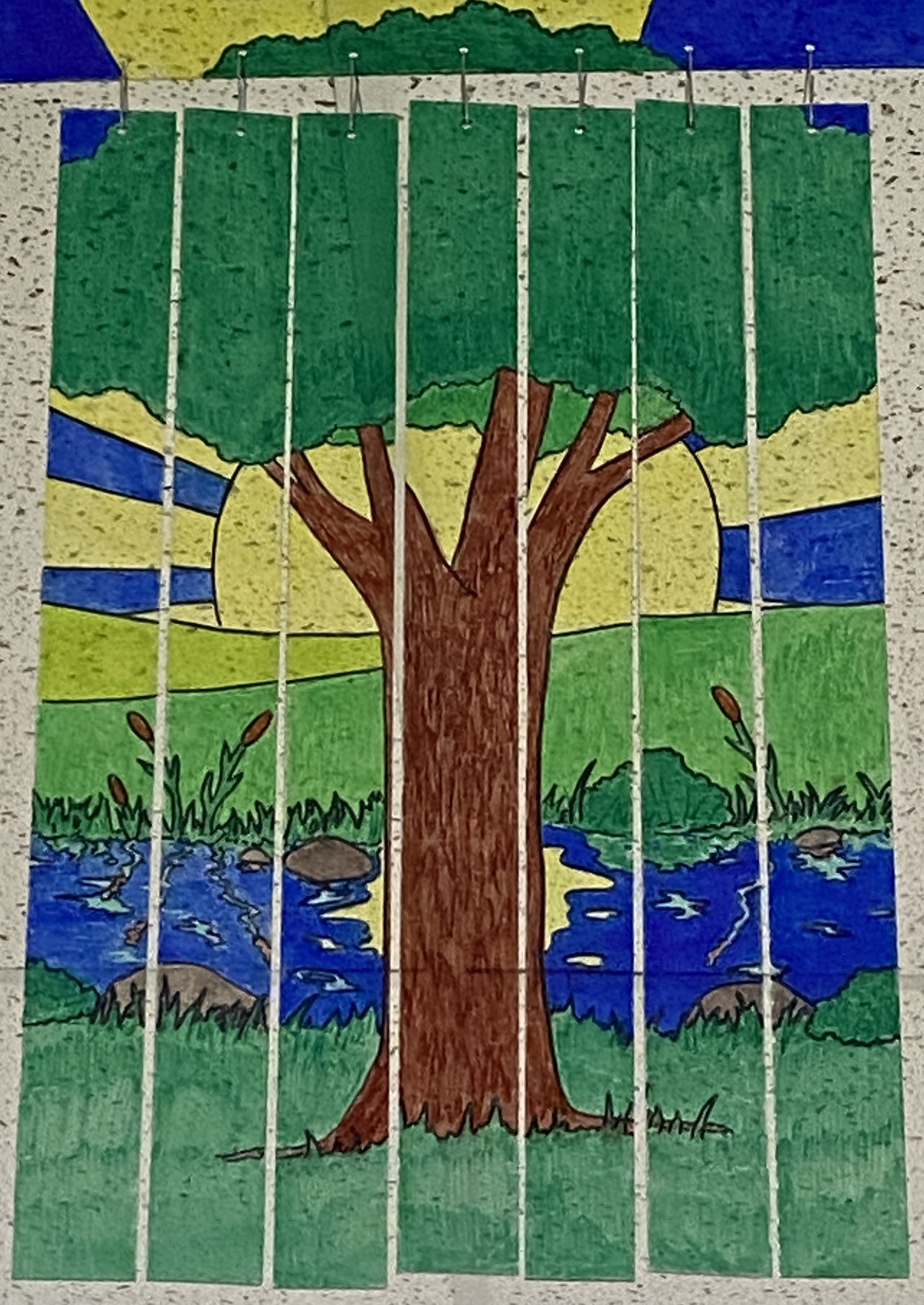 Clear strips of tile hung from ceiling, colored with outdoor scene including a tree and the sun