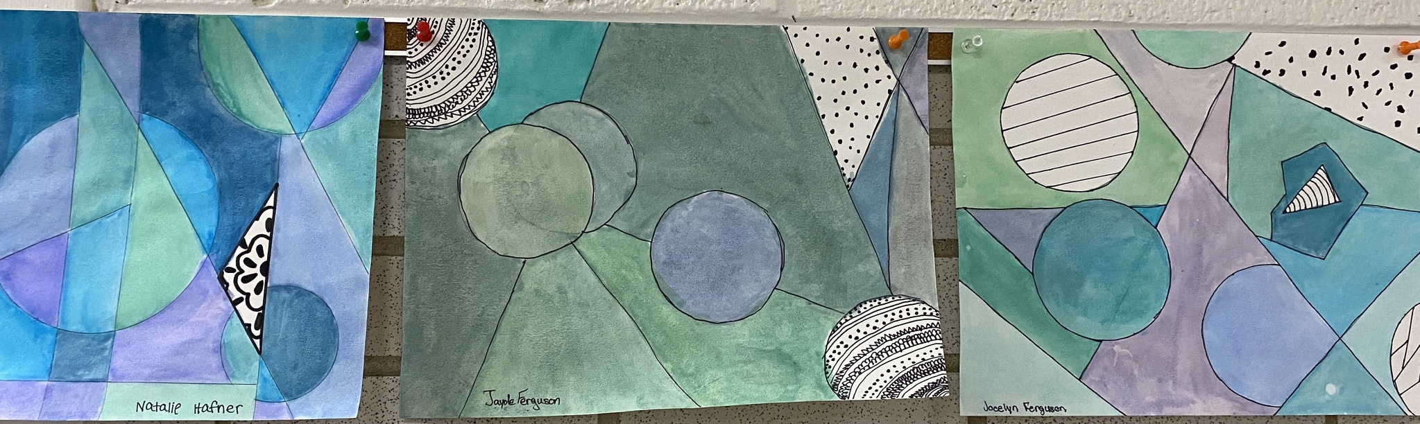 Random shapes on paper painted with pastel colors of blue, green, and purple