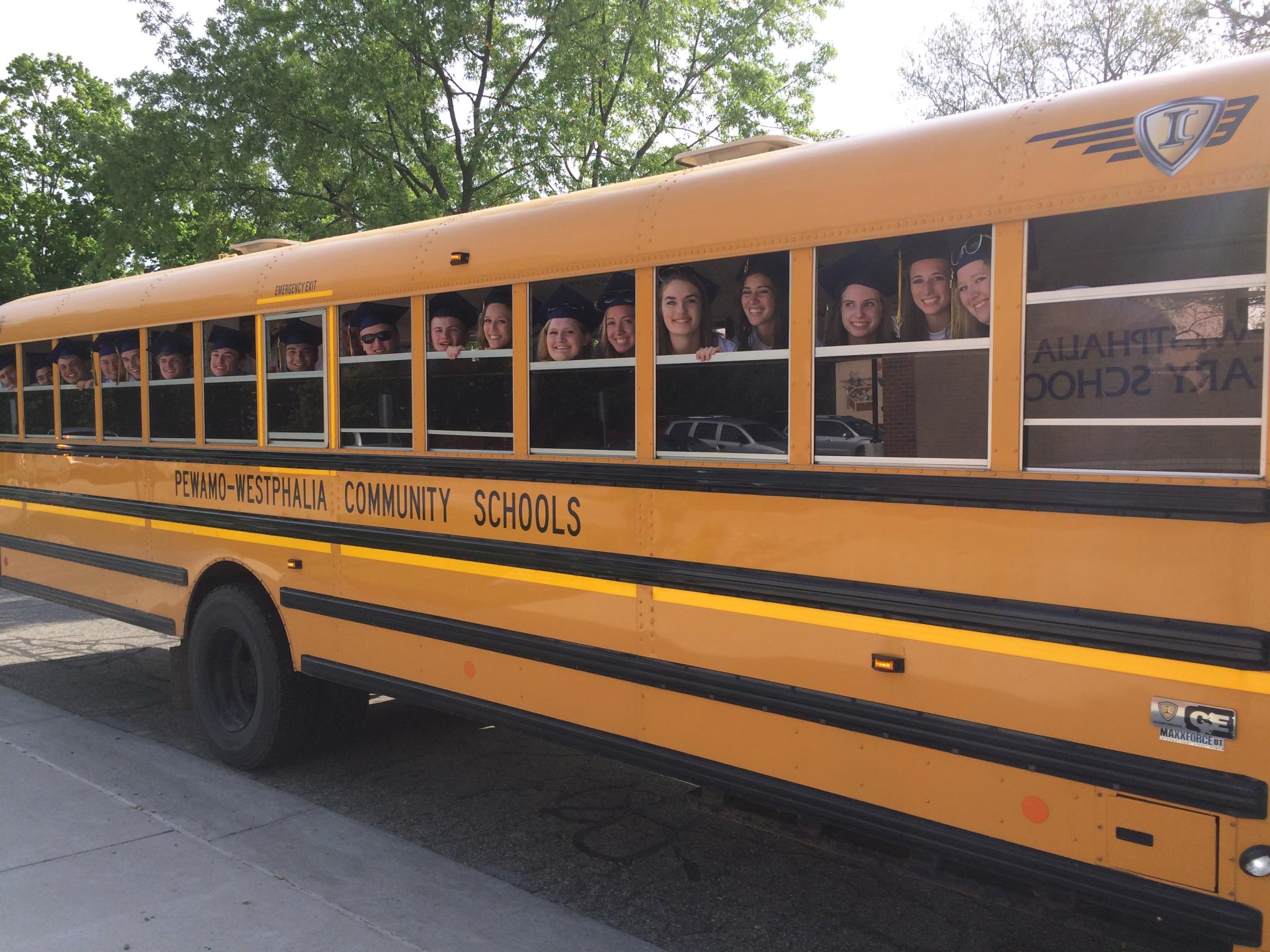 The Class of 2017 gather on a bus after visiting Pewamo Elementary School on their last day as PW students.